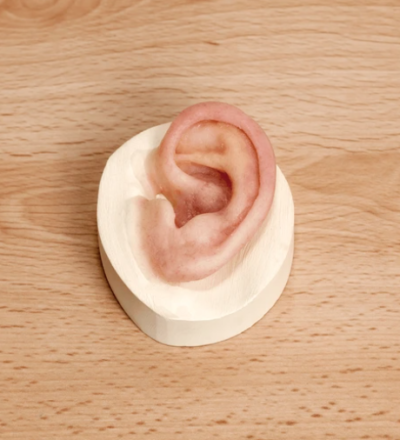 Example image of a realistic silicone prosthetic ear showing natural skin tone SEE Prosthetics Essex